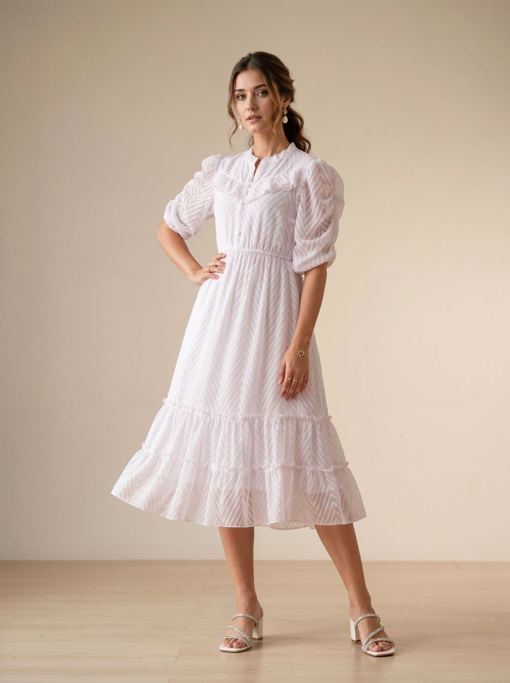 Woman wearing a white lace dress in a minimalistic setting