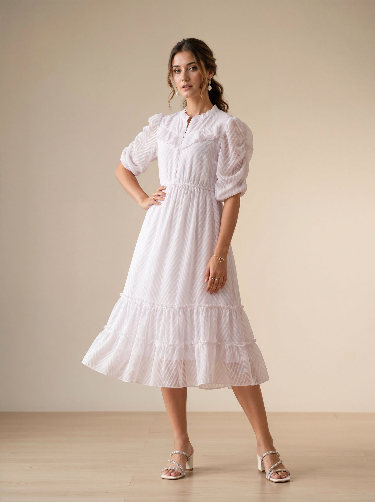 Woman wearing a white lace dress in a minimalistic setting