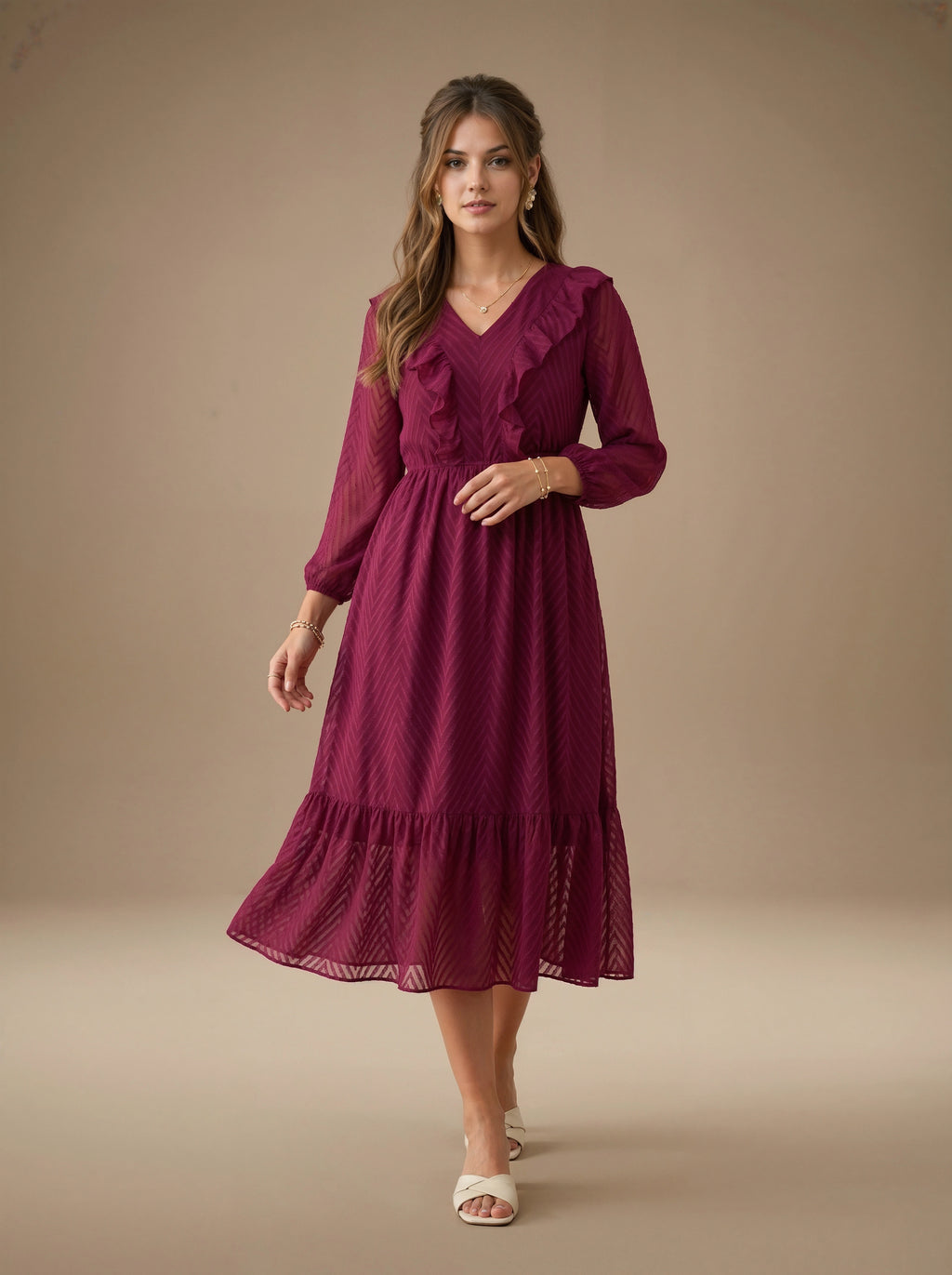 Woman wearing a burgundy dress against a beige background