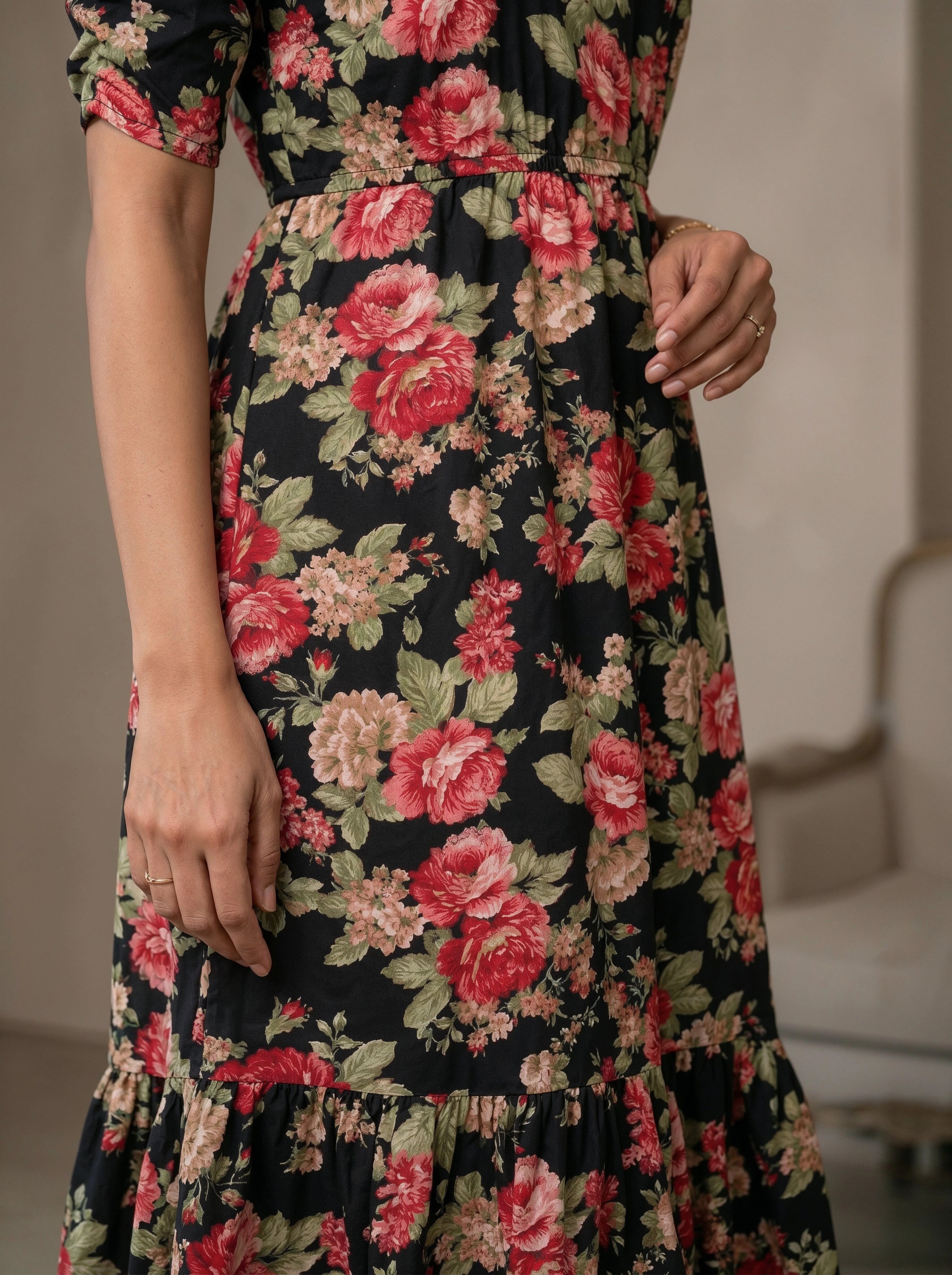 Floral dress with red and pink flowers on a black background