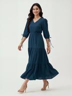 Woman wearing a blue dress on a white background