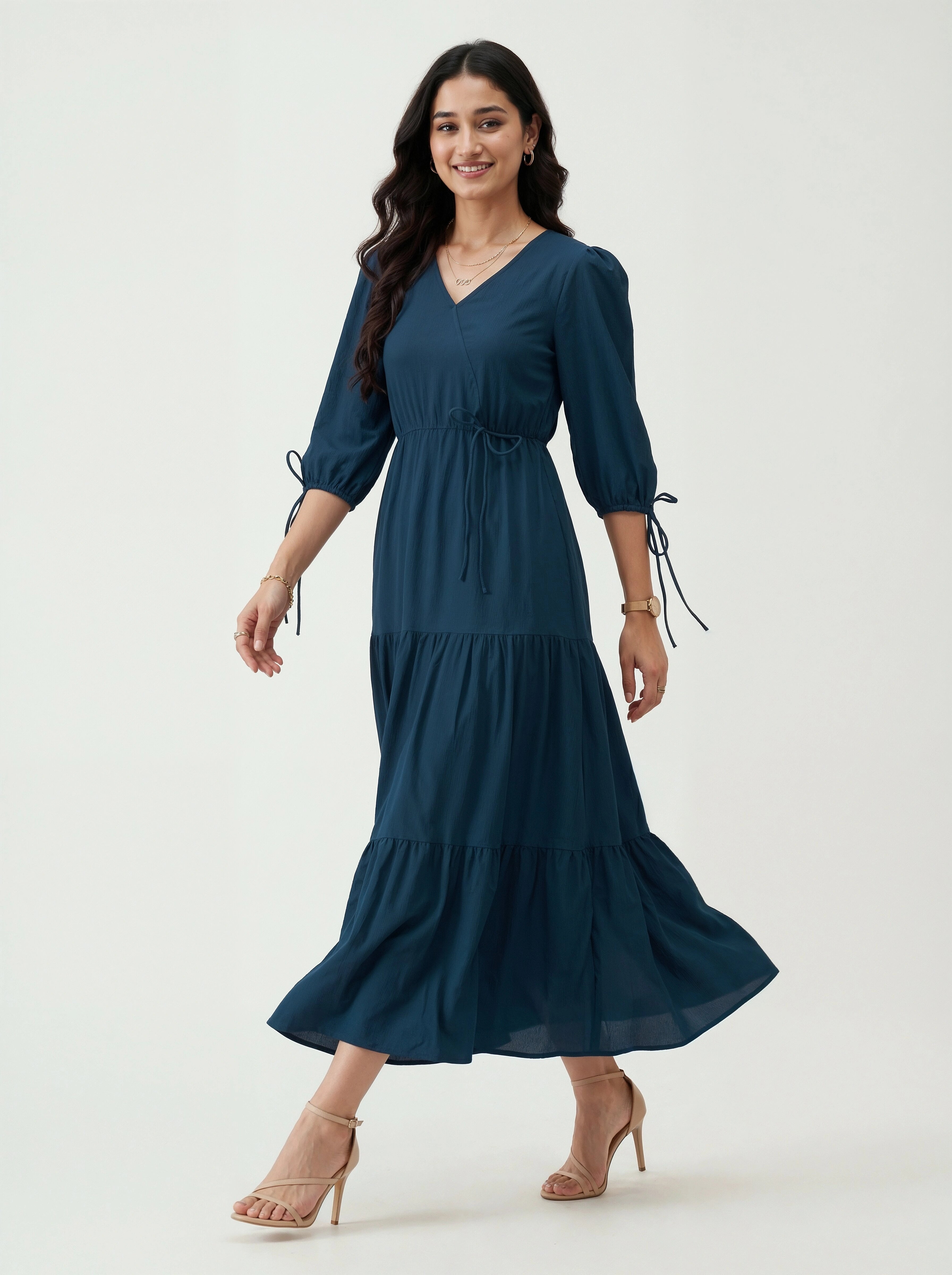 Woman wearing a blue dress on a white background