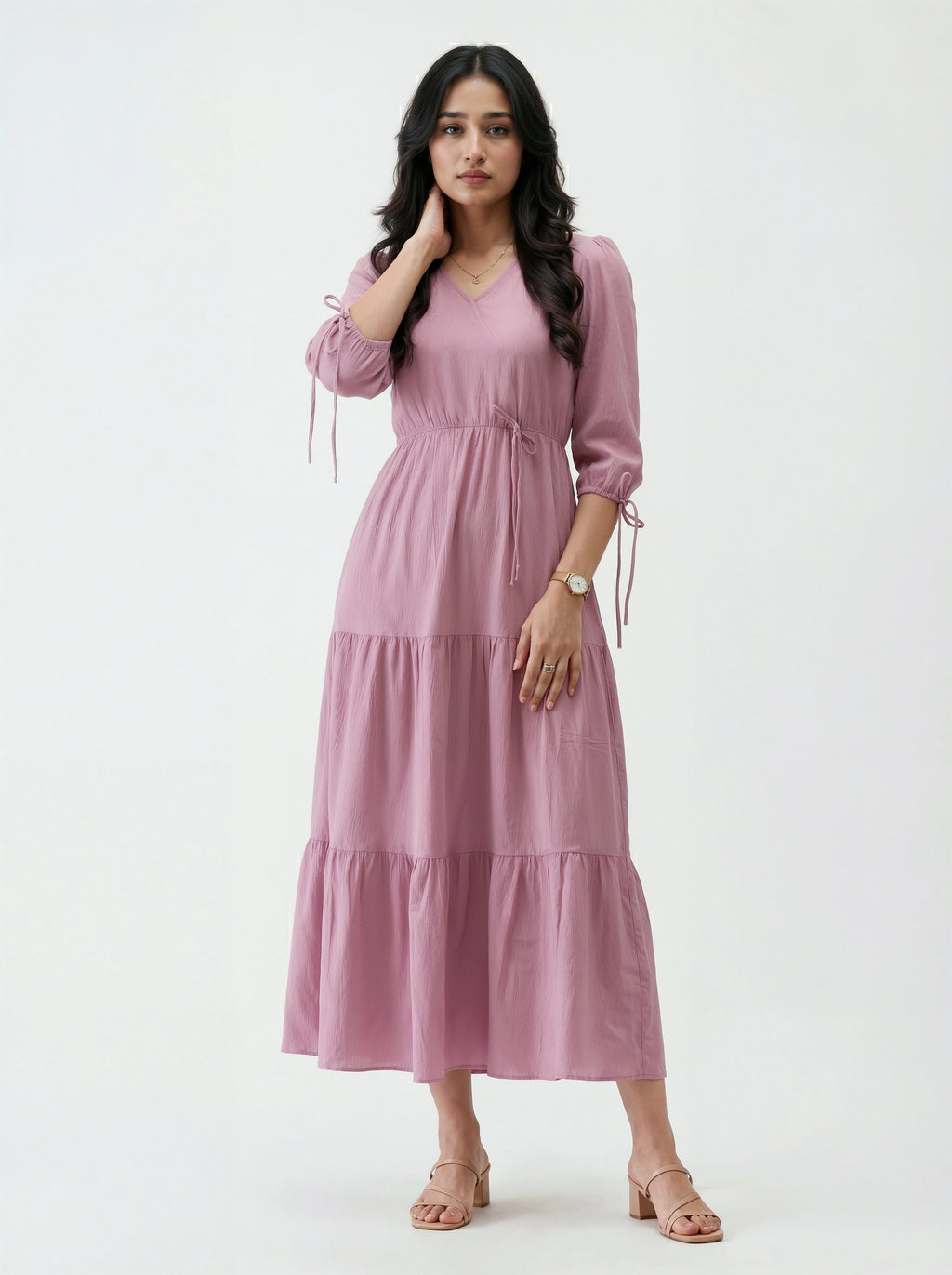 Woman wearing a pink dress on a white background