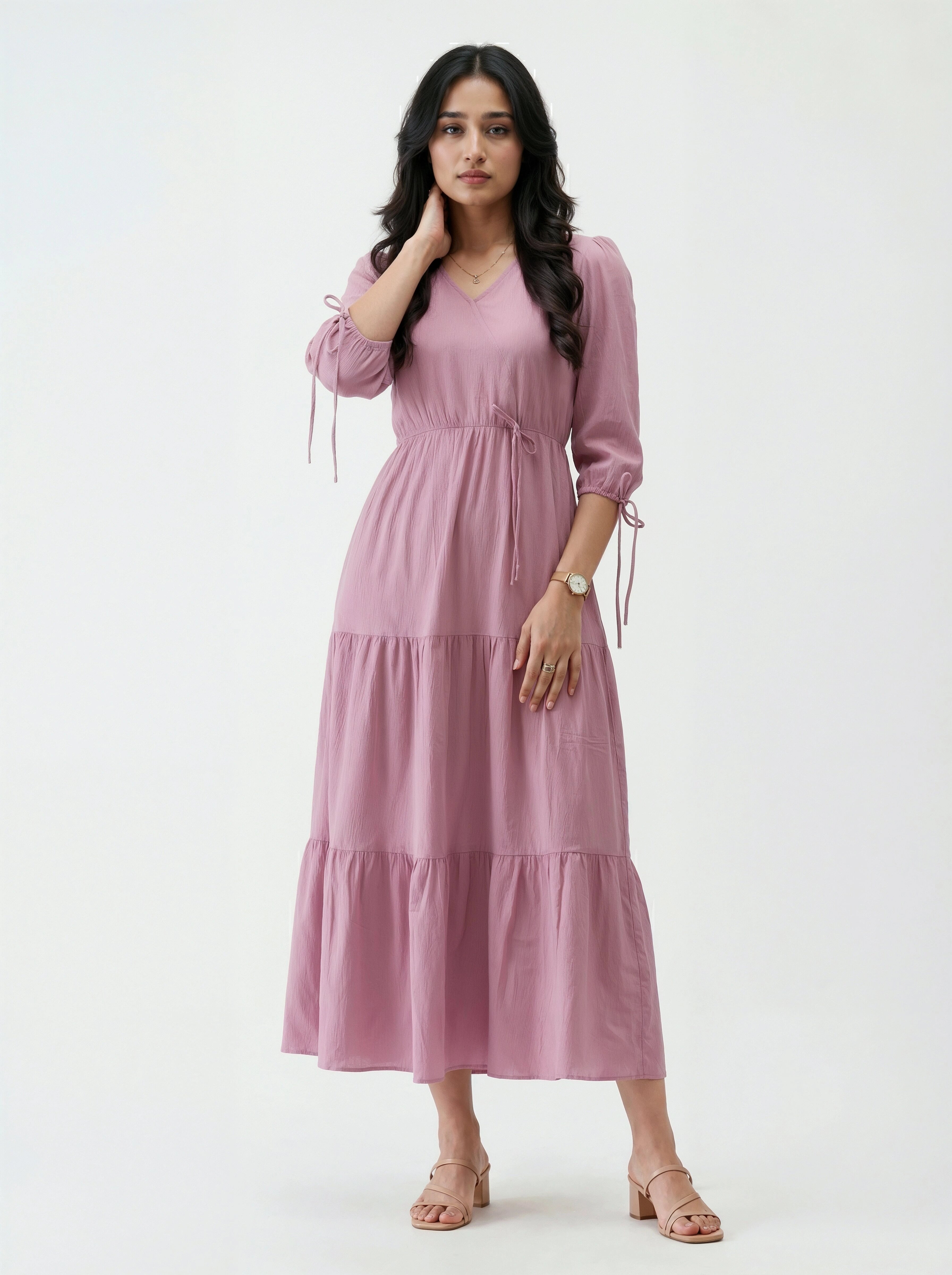 Woman wearing a pink dress on a white background