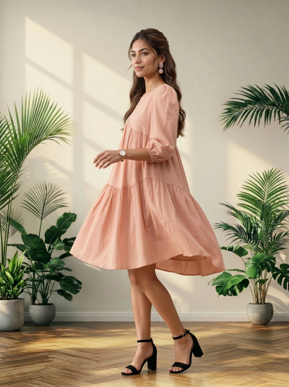 Woman in a pink dress standing in a room with plants