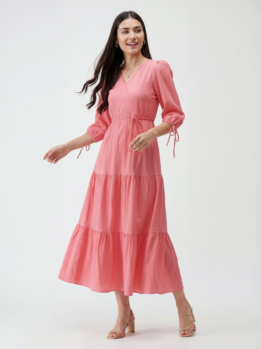 Woman wearing a pink dress on a white background