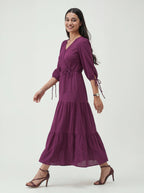 Woman wearing a purple dress on a white background