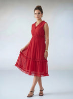 Woman wearing a red dress on a white background