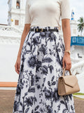 Person wearing a floral skirt with a white background