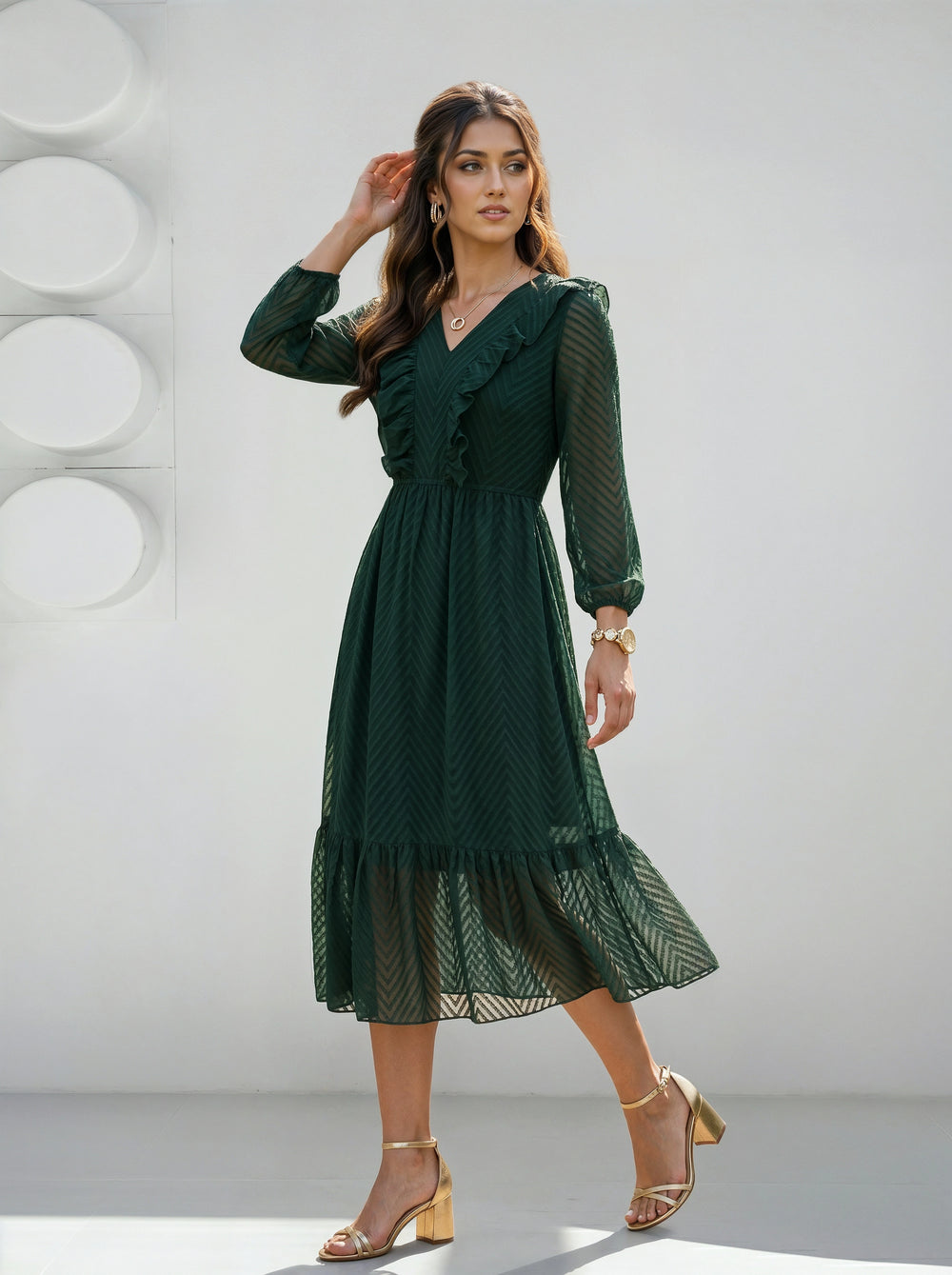 Woman wearing a green dress against a white background