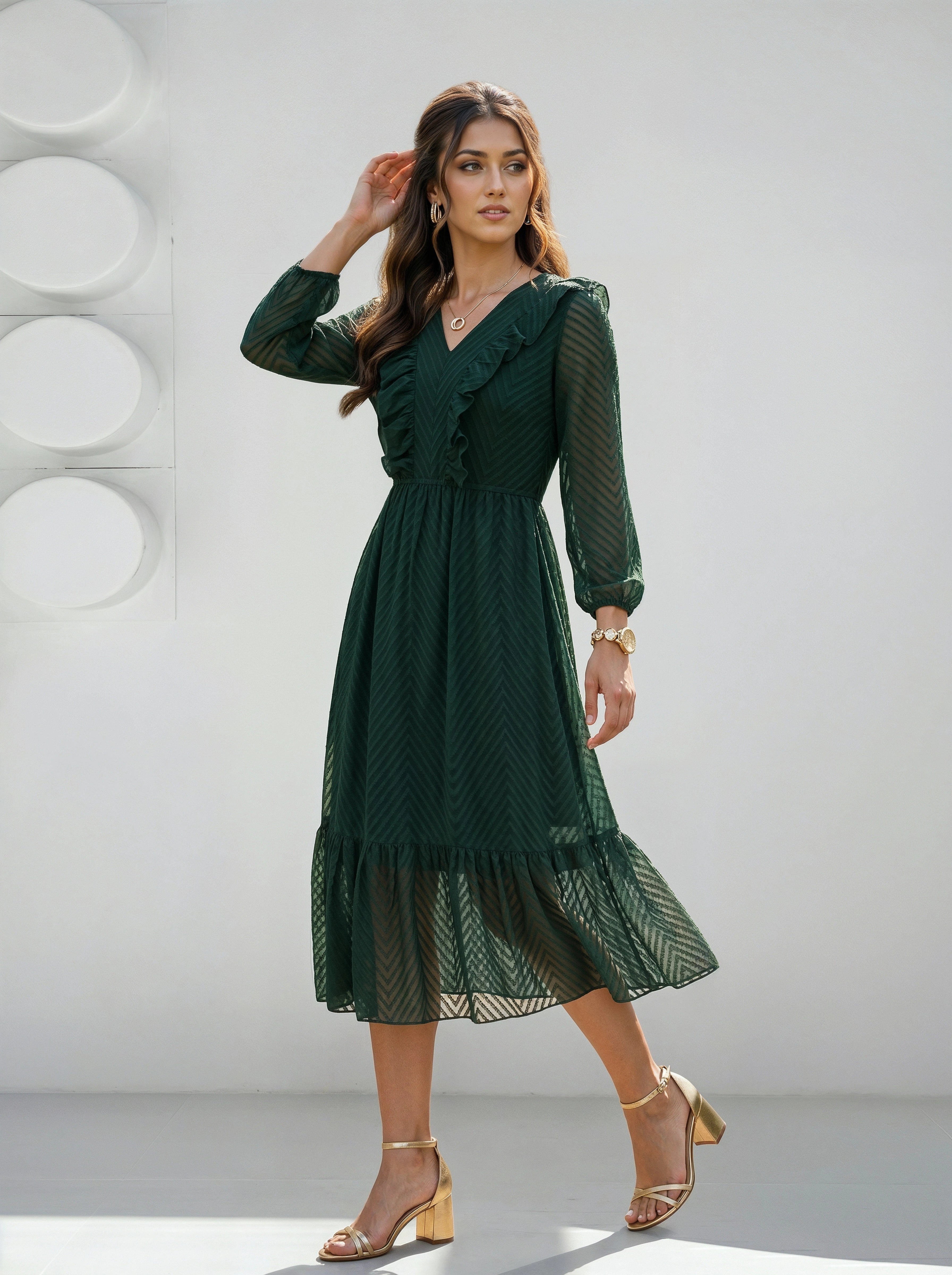 Woman wearing a green dress against a white background
