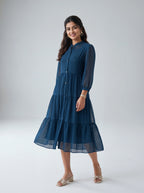 Woman wearing a blue dress on a white background