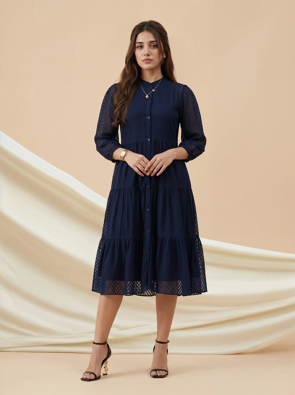 Woman wearing a navy blue dress on a beige background