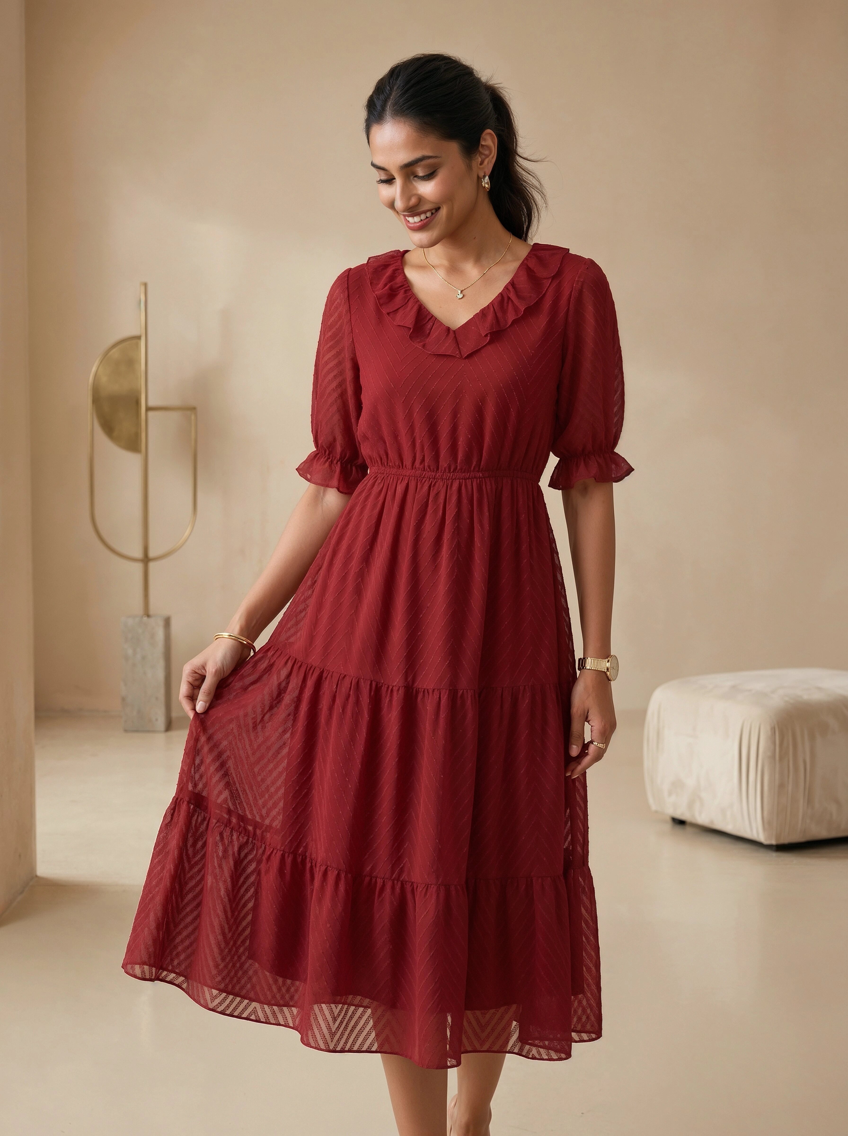 Woman wearing a red dress in a minimalistic room