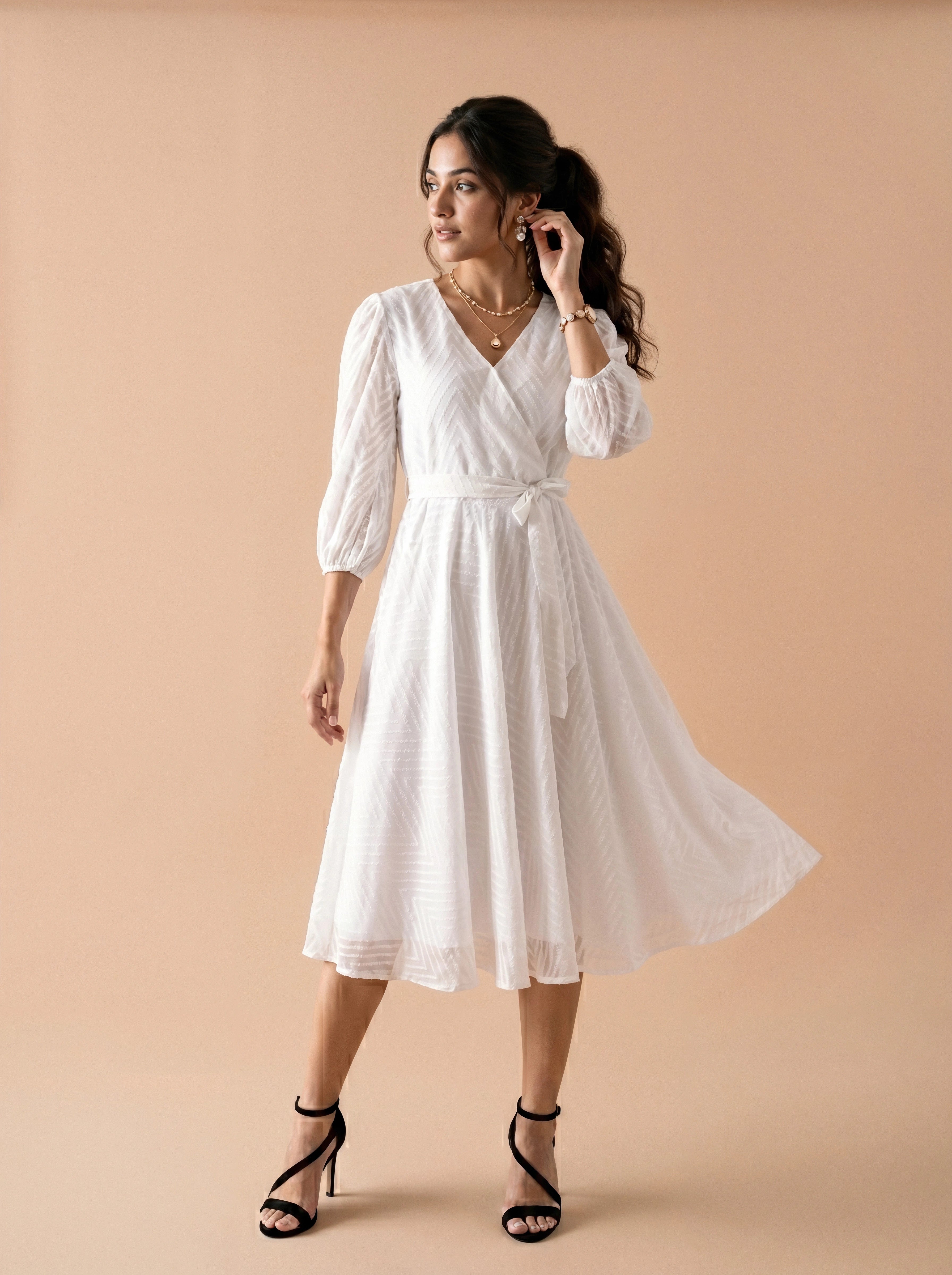 Woman wearing a white dress against a beige background