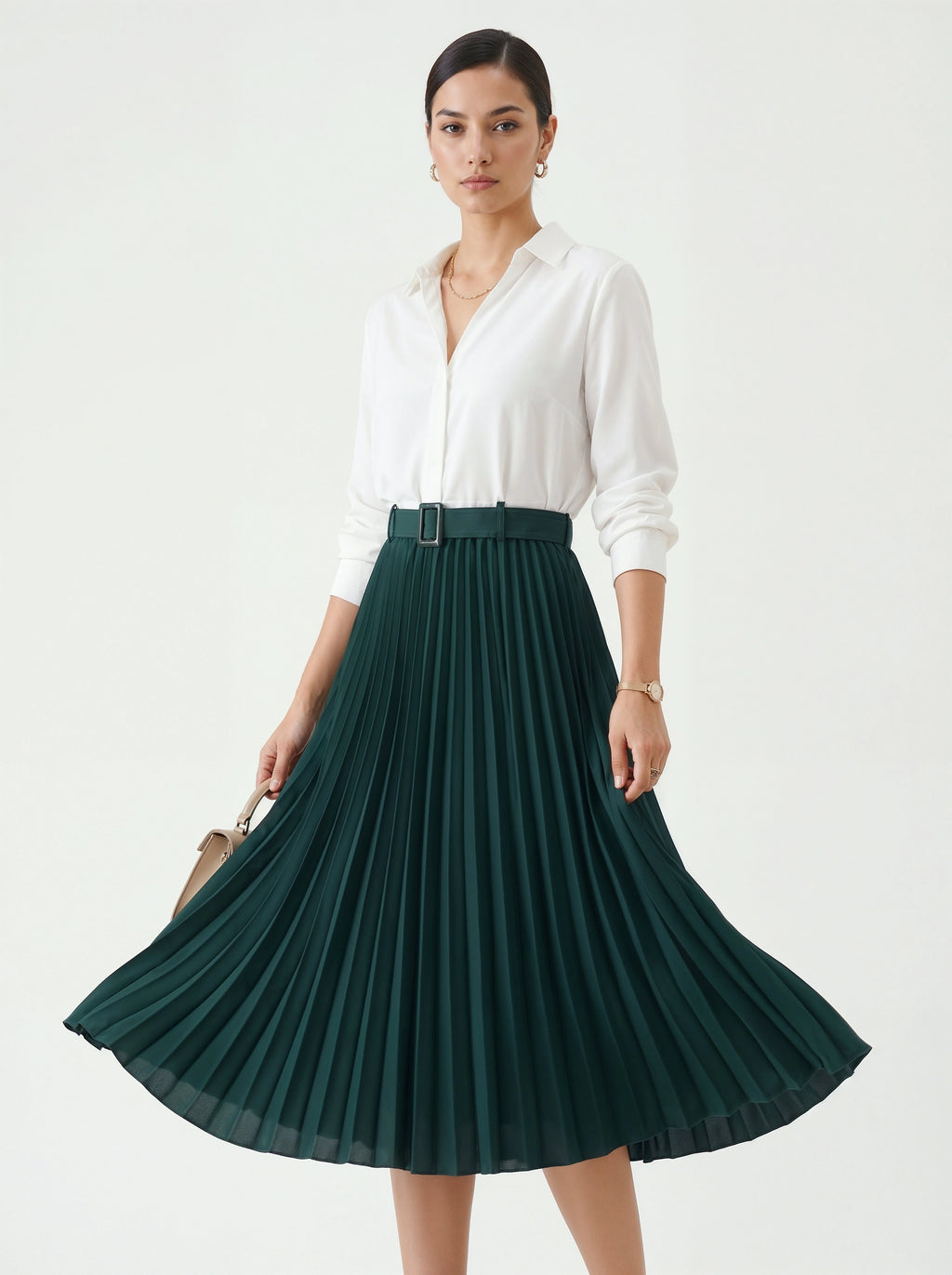 Woman wearing a white blouse and green pleated skirt on a white background