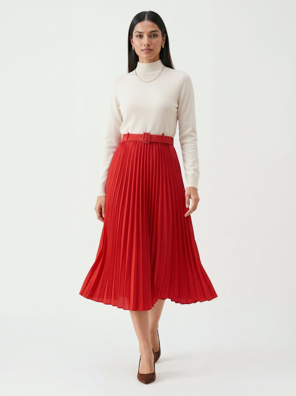 Woman wearing a white turtleneck and red pleated skirt on a white background