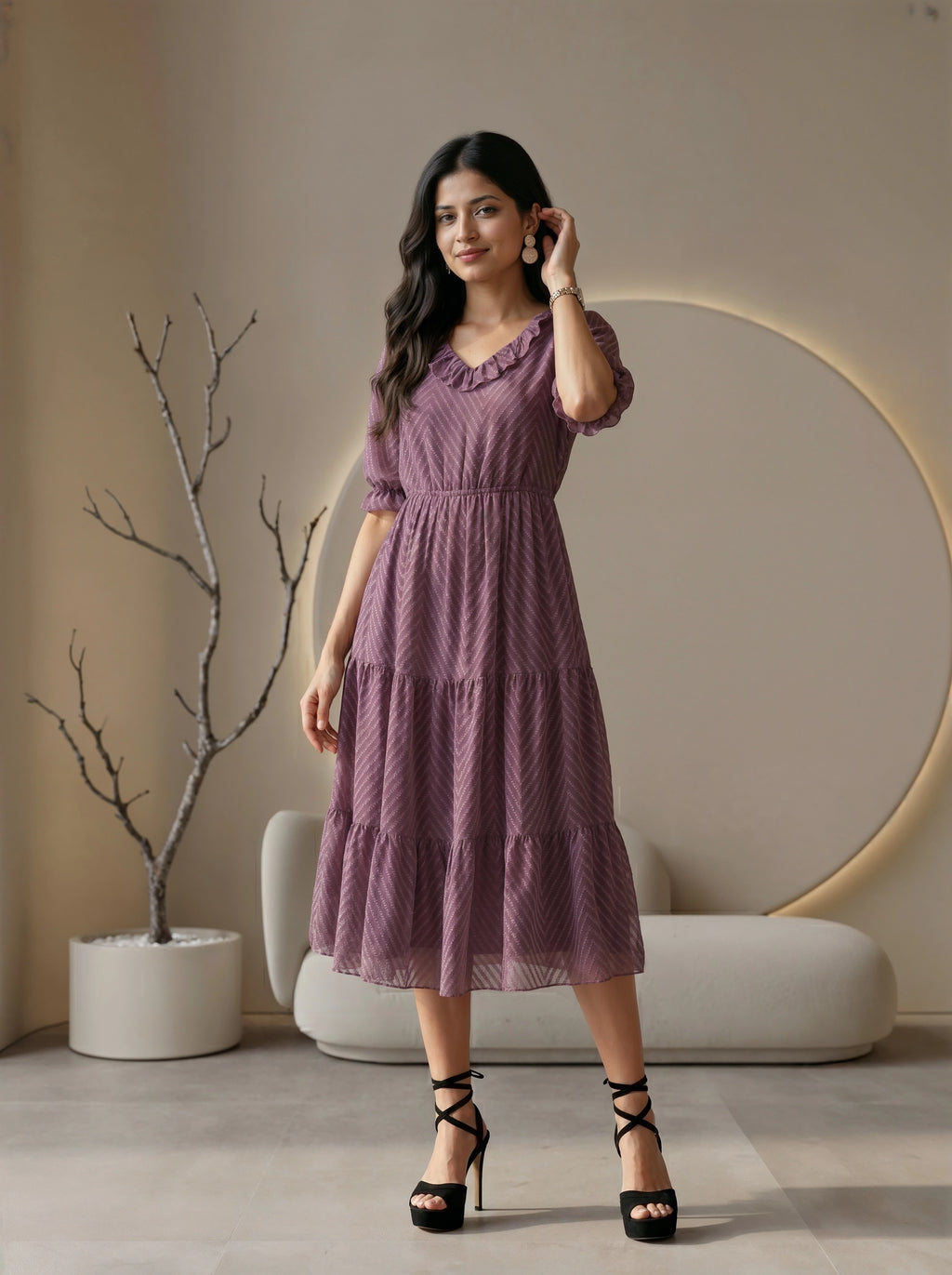 Woman wearing a black dress in a modern living room