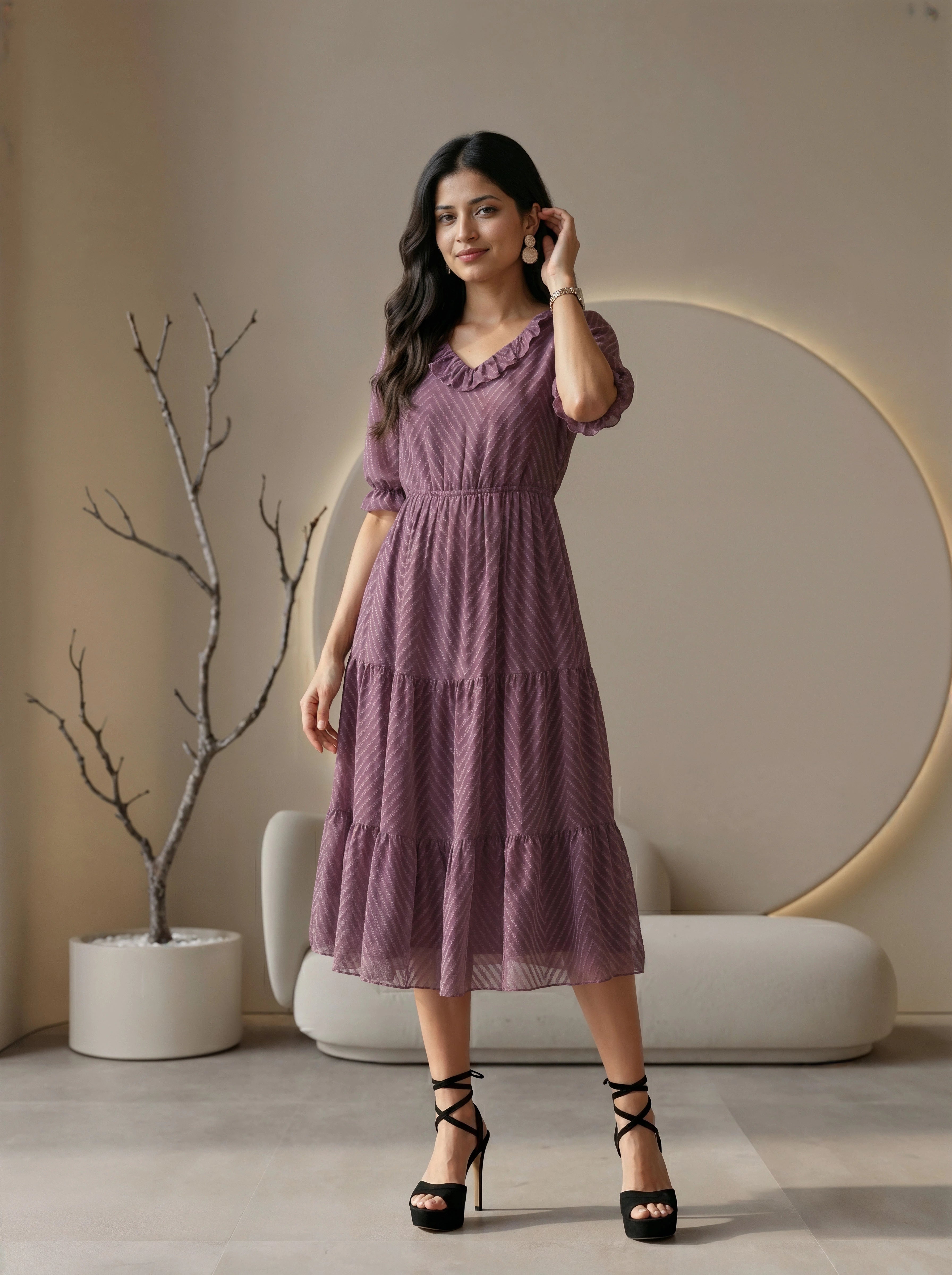 Woman wearing a black dress in a modern living room