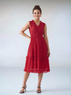 Woman wearing a red dress against a white background