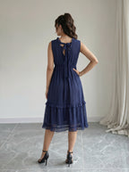 Elegant Textured Blue Dress with Model Backside Pose