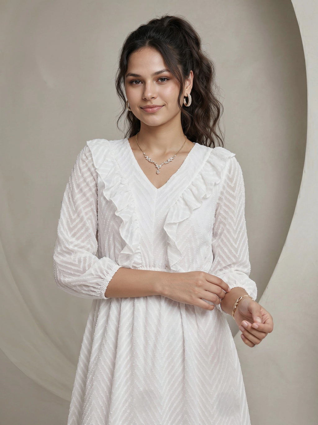Woman wearing a white dress with a neutral background