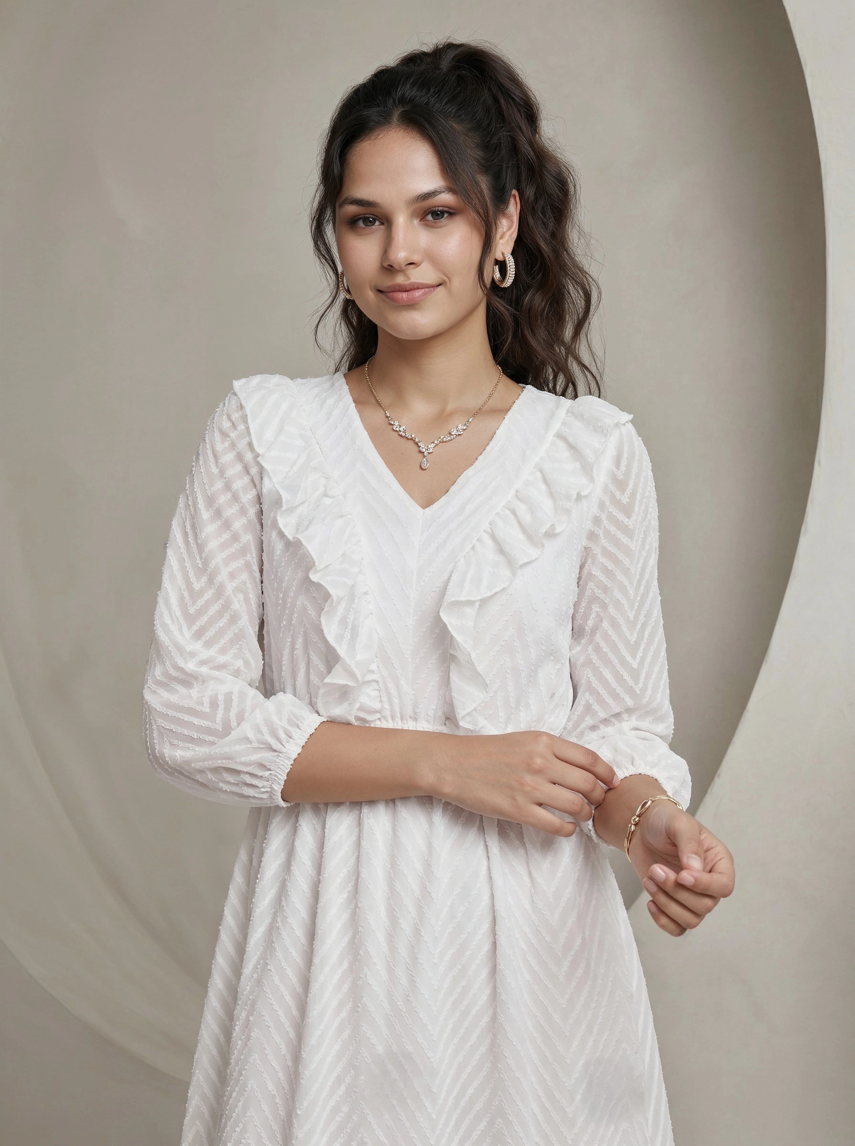 Woman wearing a white dress with a neutral background