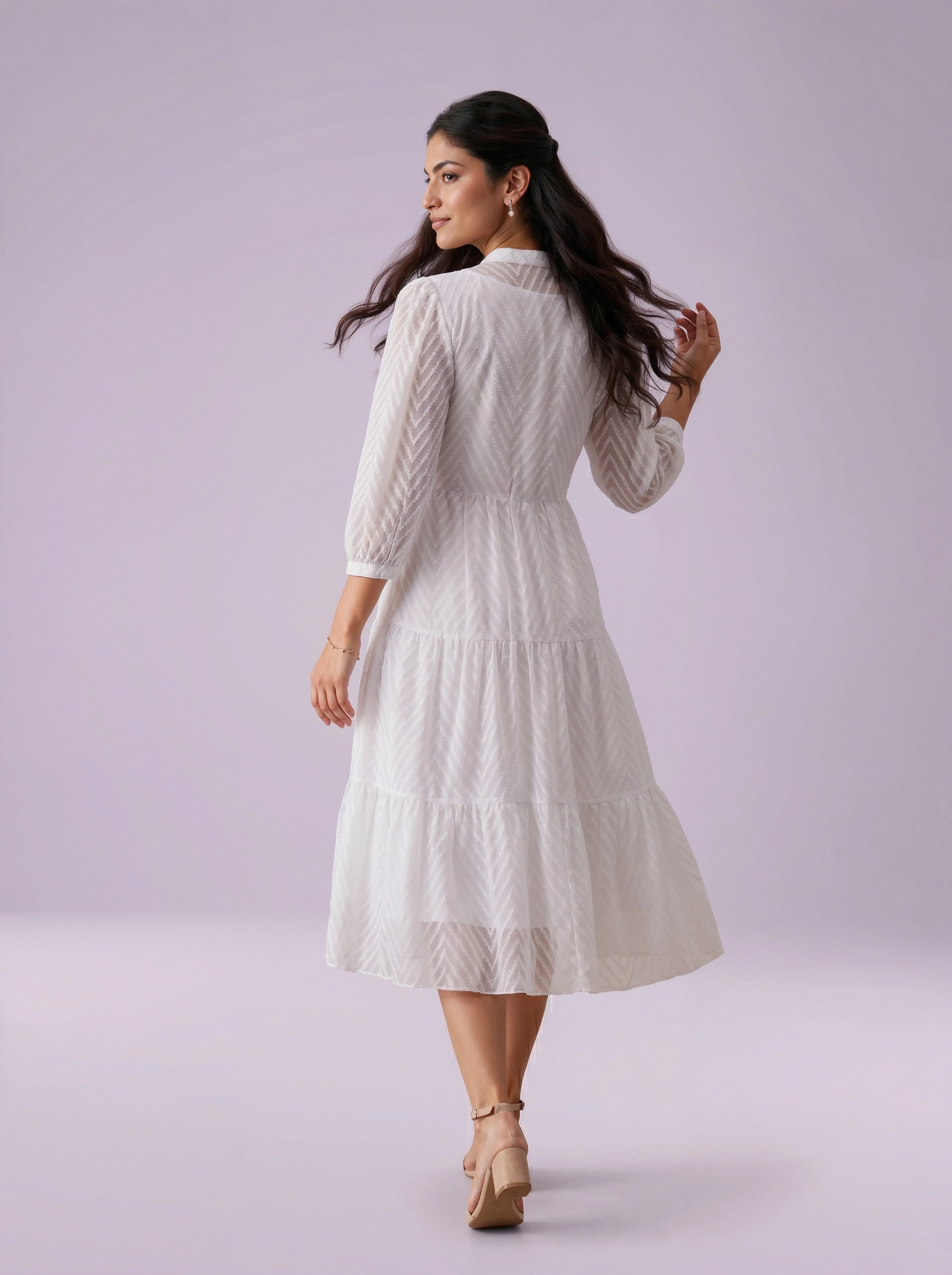 Woman wearing a white dress on a light purple background