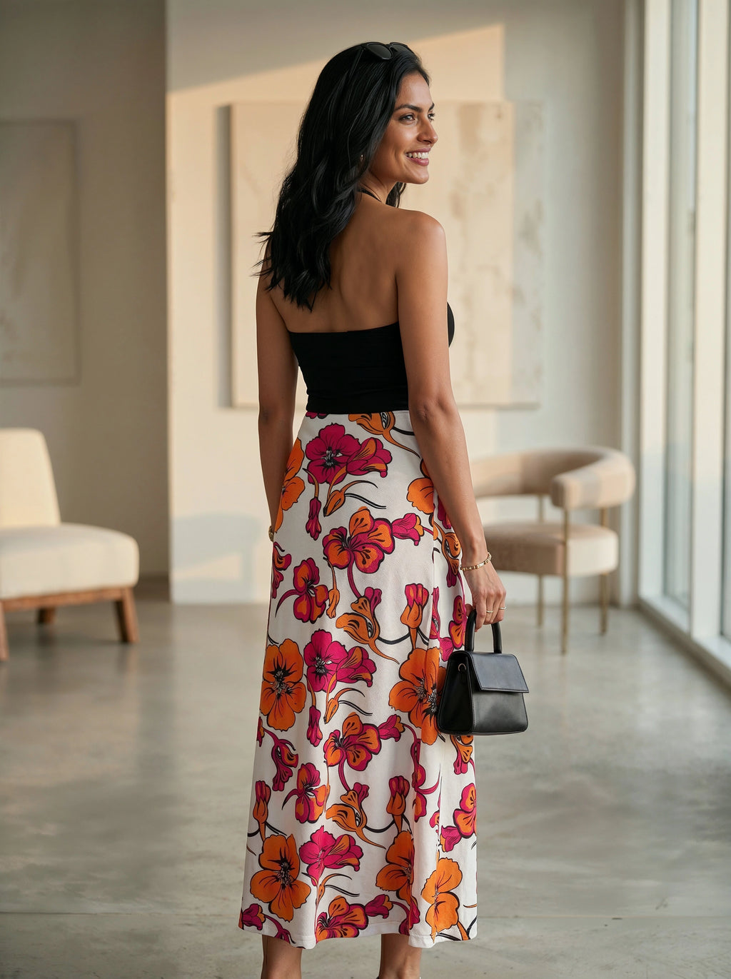 Woman in a floral dress standing in an indoor setting