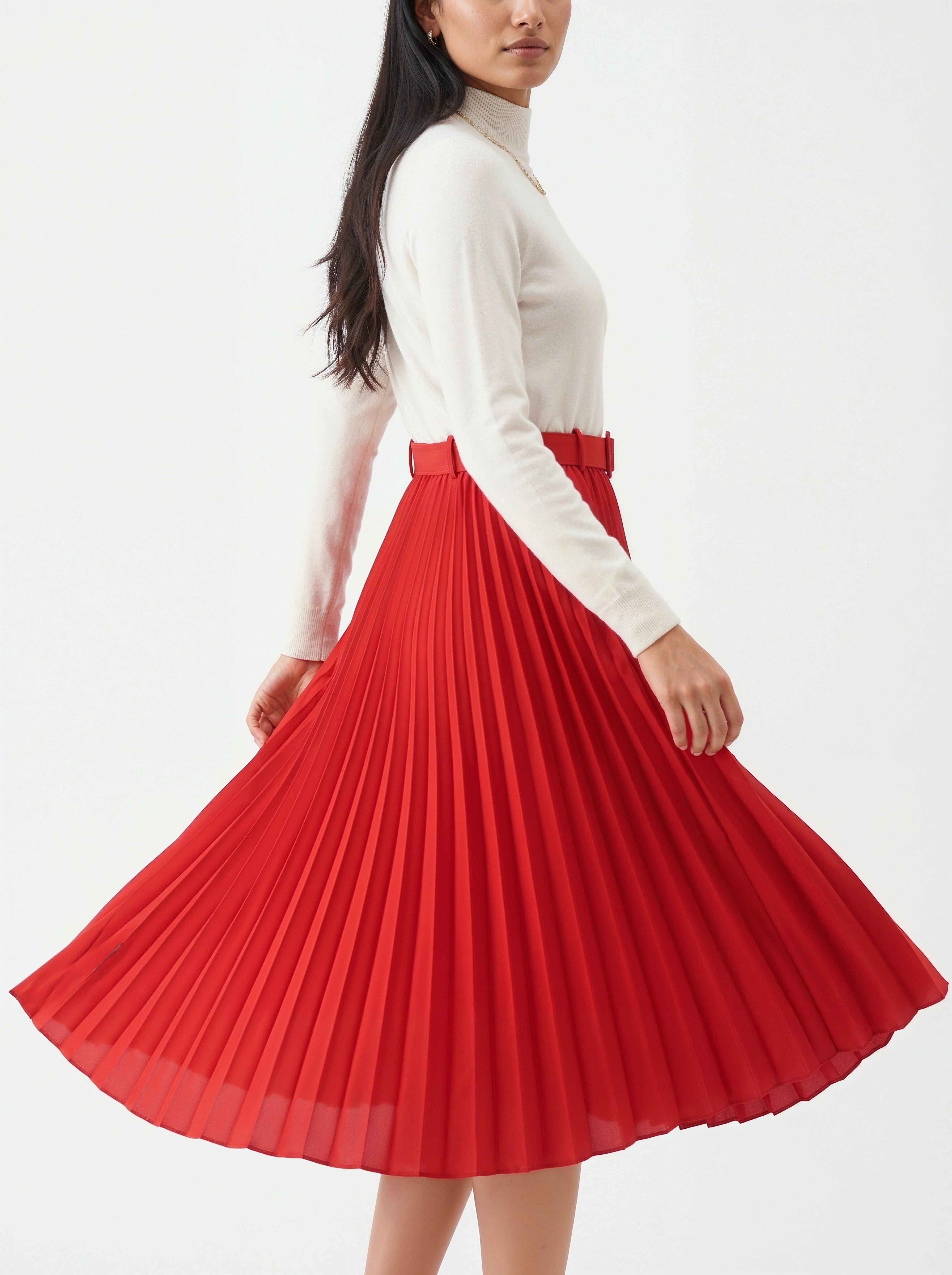 Woman wearing a white turtleneck and red pleated skirt on a white background