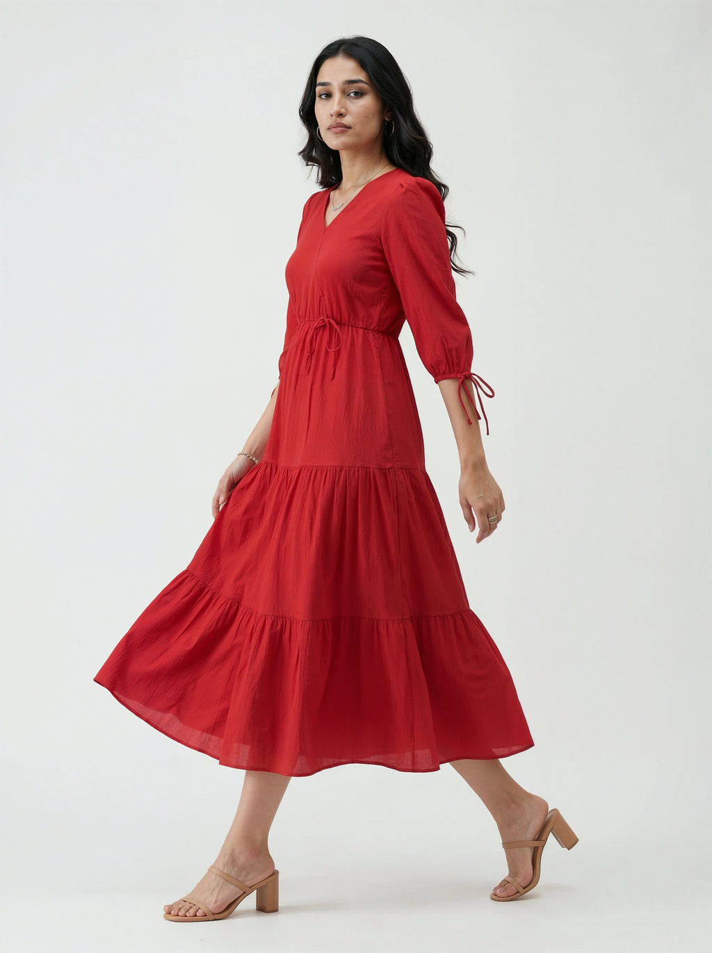 Woman wearing a red dress on a white background