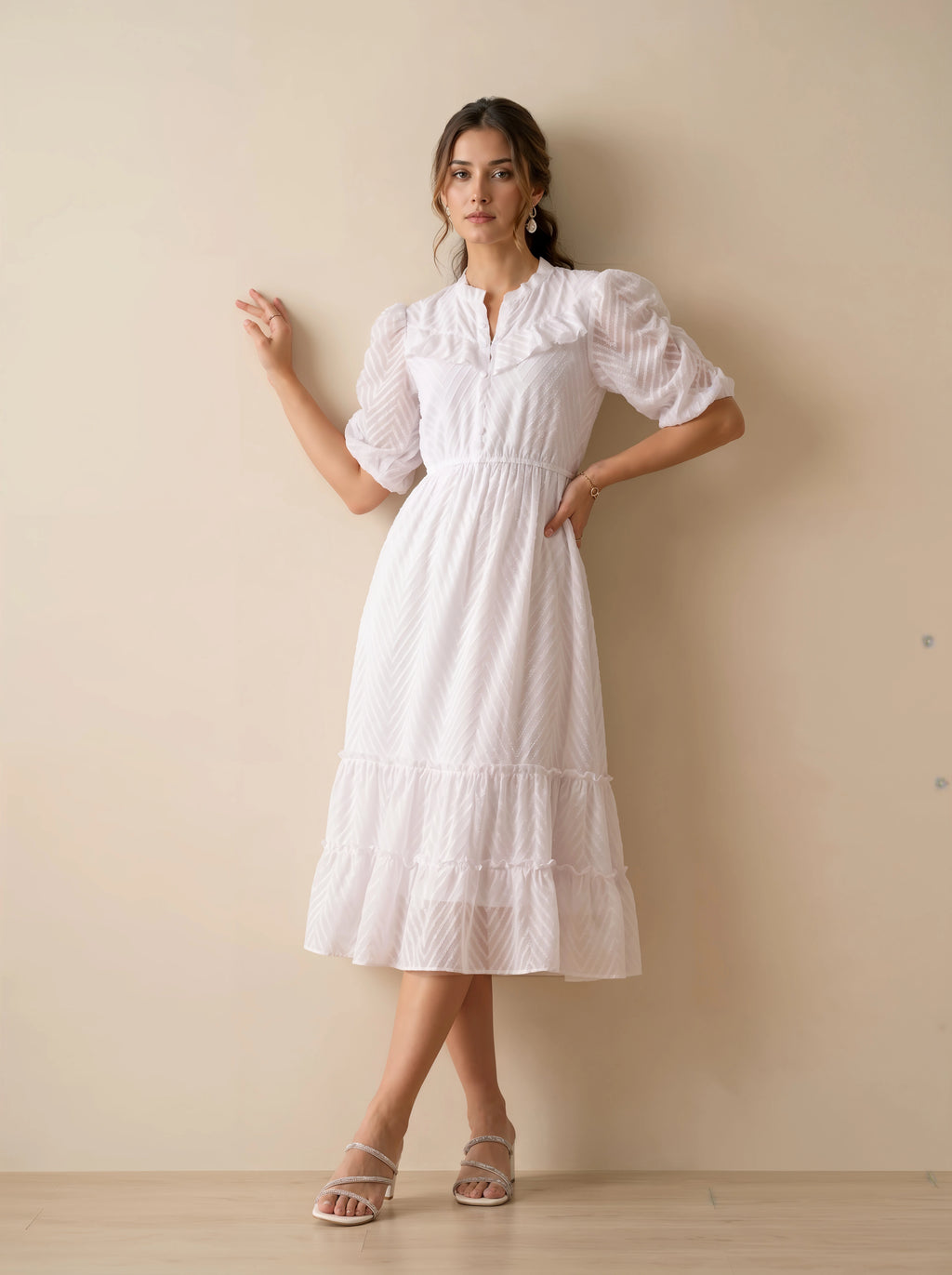 Woman wearing a white lace dress in a minimalistic setting