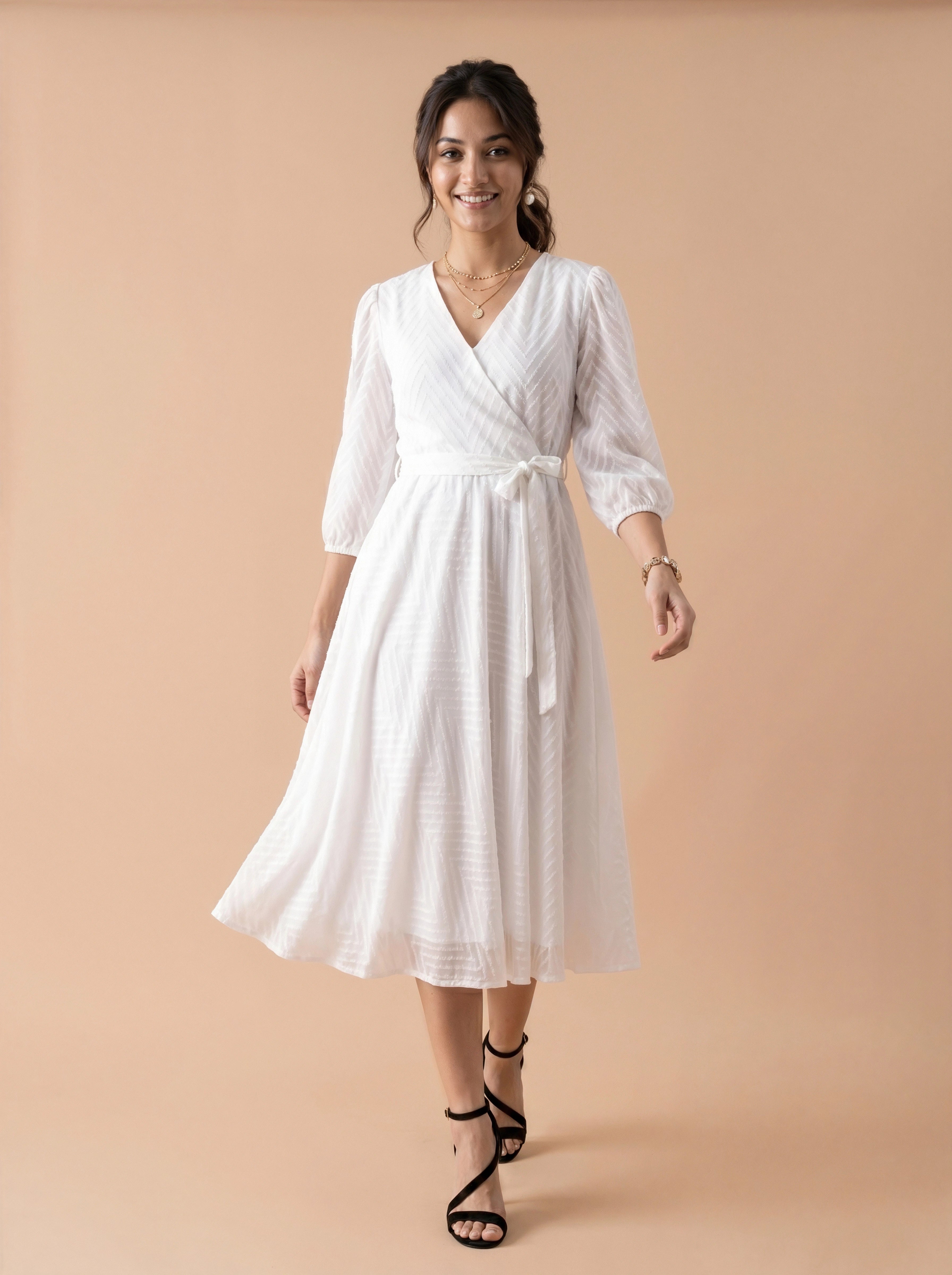 Woman wearing a white dress on a beige background