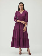 Woman wearing a purple dress on a white background
