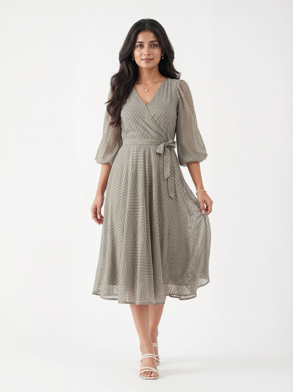 Woman wearing a gray dress with a white background