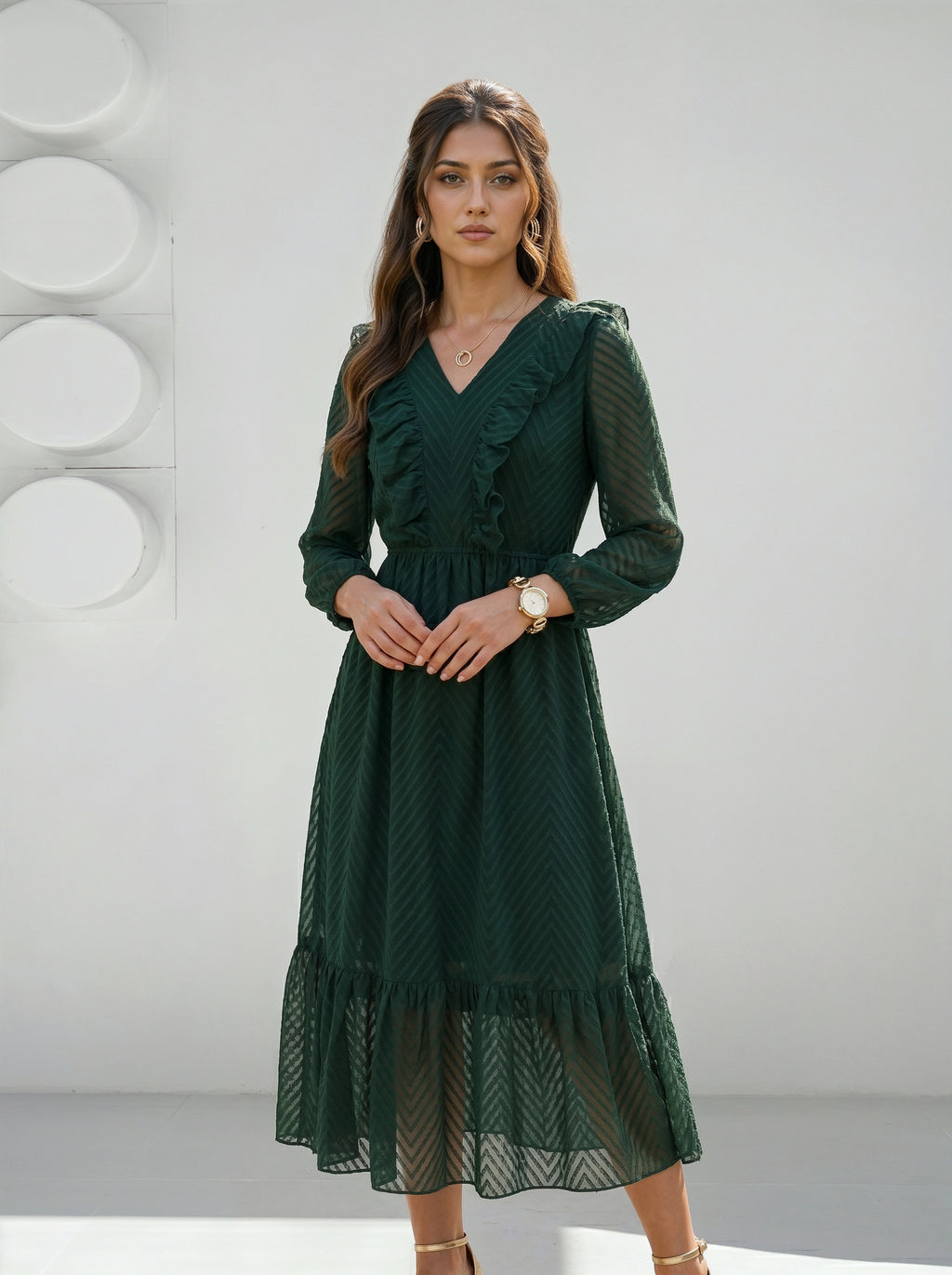 Woman wearing a green dress against a white background