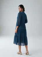 Woman wearing a blue dress on a white background