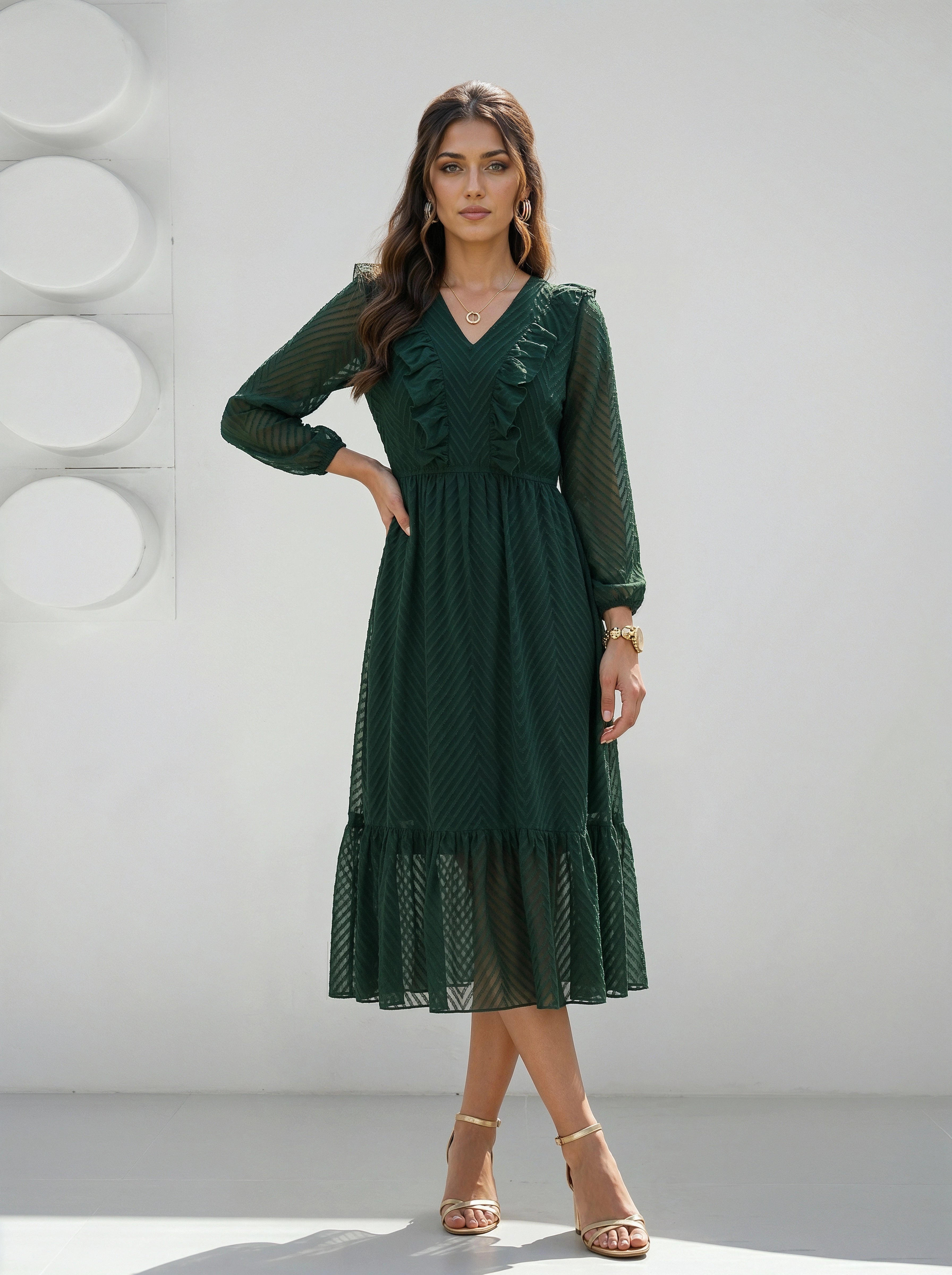 Woman wearing a green dress against a white background