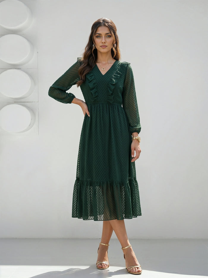 Woman wearing a green dress against a white background