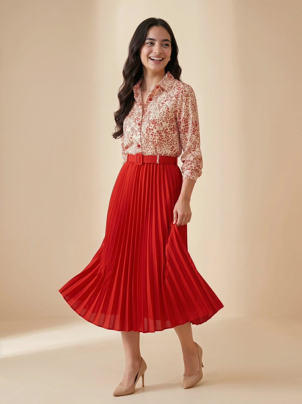 Woman wearing a floral blouse and red pleated skirt on a beige background