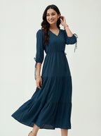 Woman wearing a dark blue dress on a white background