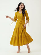 Woman wearing a yellow dress on a white background