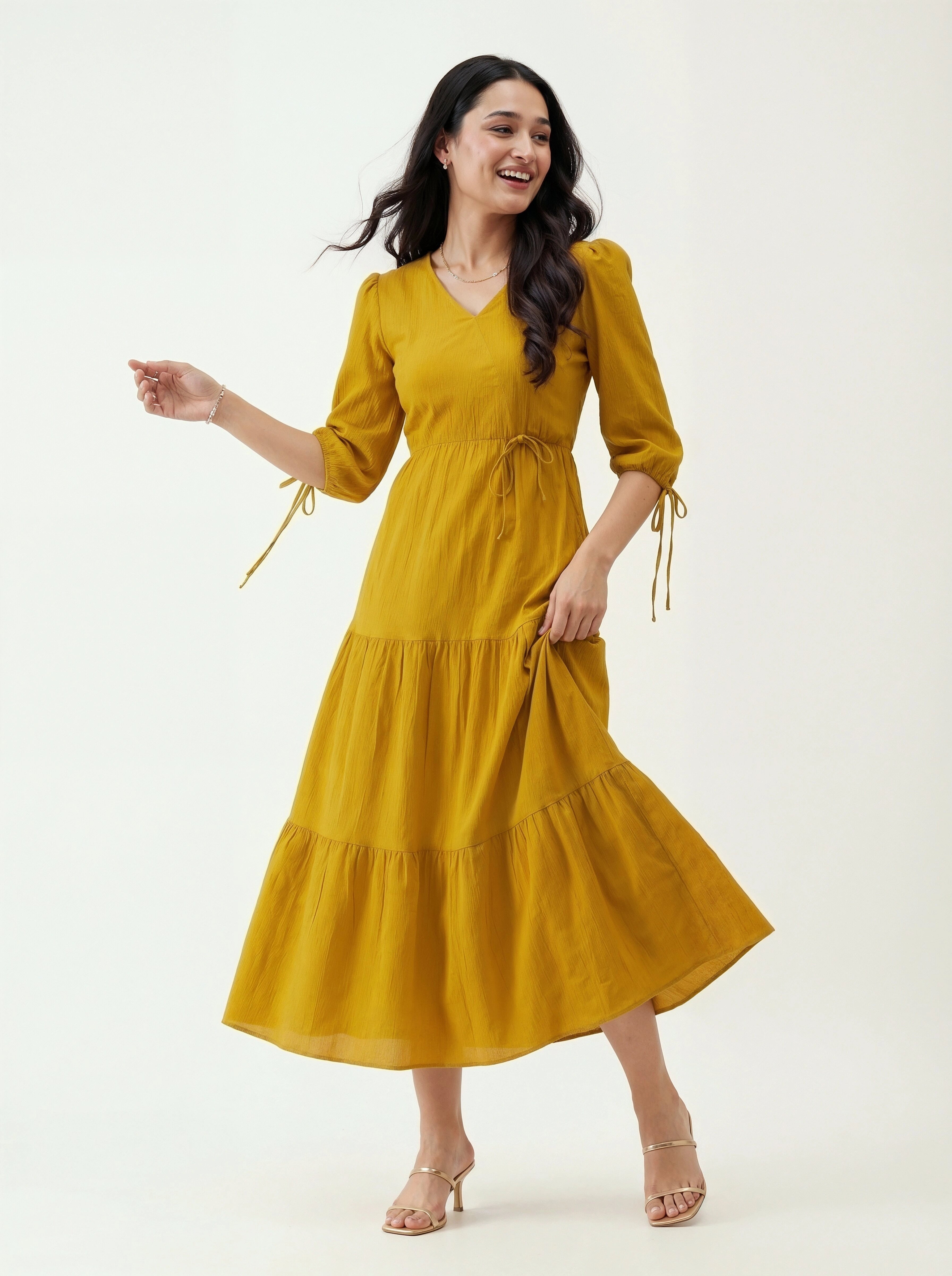 Woman wearing a yellow dress on a white background