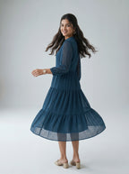 Woman wearing a blue dress on a white background