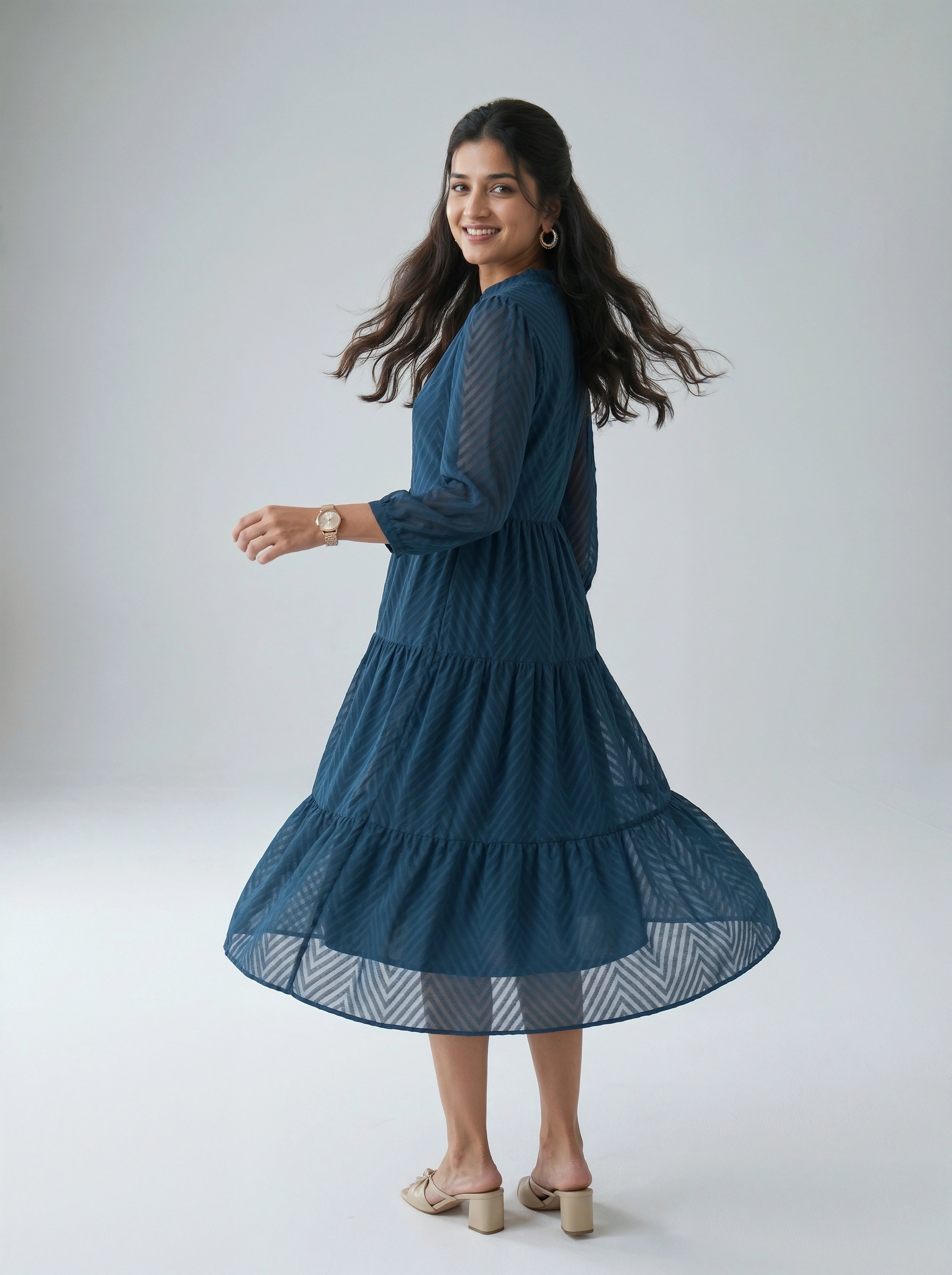 Woman wearing a blue dress on a white background