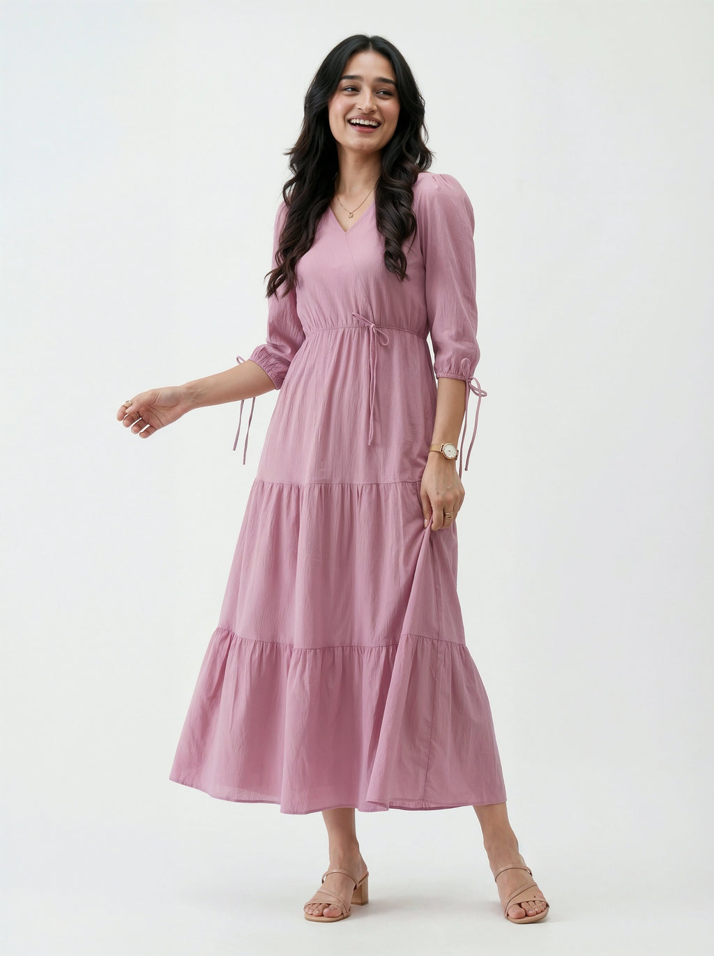 Woman wearing a pink dress on a white background