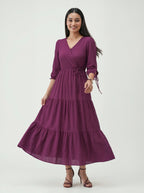 Woman wearing a purple dress on a white background