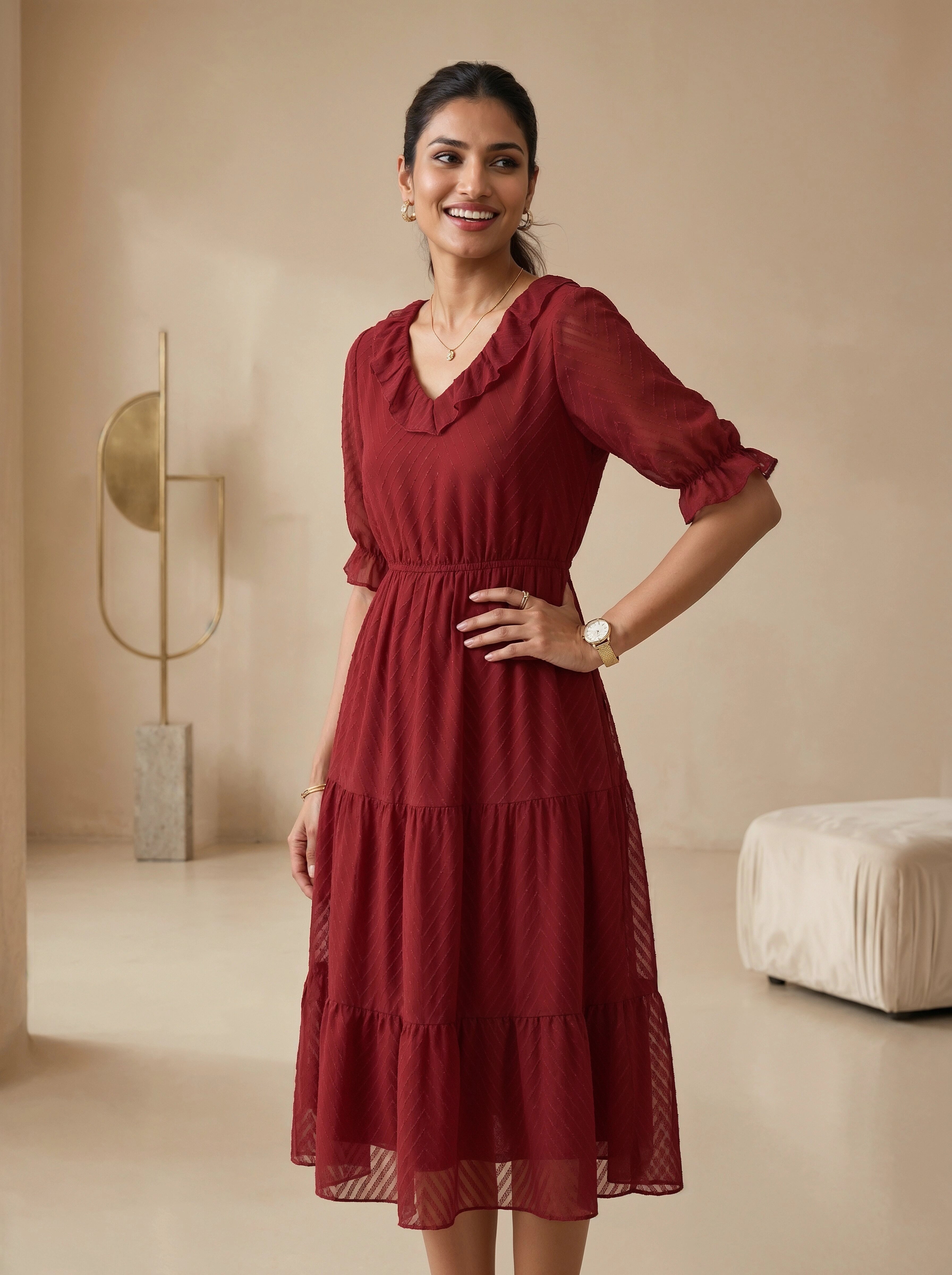 Woman wearing a red dress in a neutral-colored room