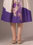 Skirt with floral design and purple bottom section on a neutral background
