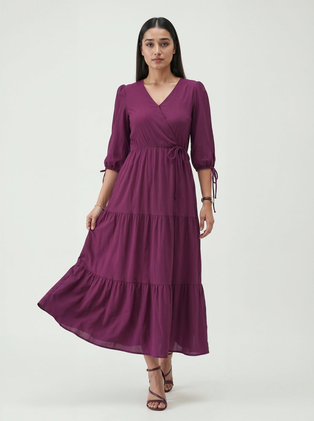 Woman wearing a purple dress on a white background